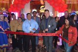 At the forefront at Wednesday's grand re-opening of the remodeled High Limit Gaming room, with scissors in hand, are Jacob Jeff, Tachi Palace slot director (left) and General Manager Michael Olujic.